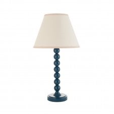 blue table lamp with vintage white tapered shade