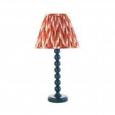 blue table lamp with orange zigzag pattern tapered shade