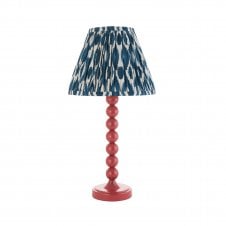 pink table lamp with blue ikat pattern shade