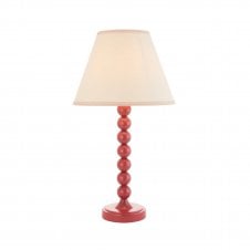 pink table lamp with vintage white tapered shade
