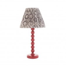 pink table lamp with grey ripple pattern tapered shade