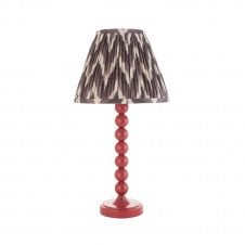 pink table lamp with grey zigzag pattern shade