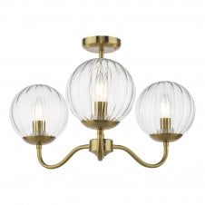 antique brass semi-flush ceiling light fitting with three glass globe shades in clear segmented glass