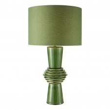 A green decorative ceramic table lamp with green cotton drum shade