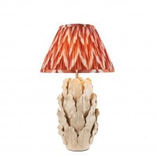 ivory ceramic table lamp with orange zigzag pattern shade