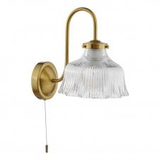 natural brass wall light with fluted ribbed glass shade