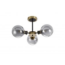 semi-flush 3 light ceiling fixture in brass and black with amber glass shades