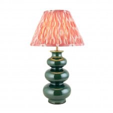 green ceramic table lamp with coral pink ikat pattern shade