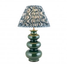 green ceramic table lamp with blue ripple pattern lampshade