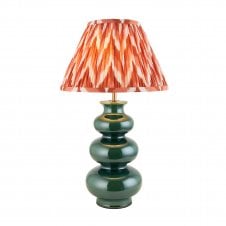 green ceramic table lamp with orange zigzag pattern lampshade