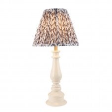 white spindle table lamp with grey leaf pattern shade