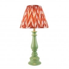 green spindle table lamp with orange zigzag pattern shade