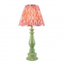 green spindle table lamp with coral pink ikat pattern shade