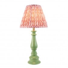 green table lamp with coral pink ripple pattern shade