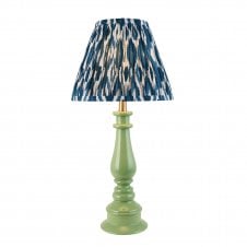 green spindle table lamp with blue ikat pattern shade
