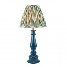 blue spindle table lamp with green zigzag pattern shade
