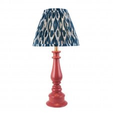 pink spindle table lamp with blue ikat pattern shade