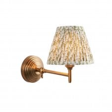 brass wall light with leaf pattern green shade