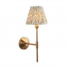 Brass T bar wall light with leaf pattern shade in green