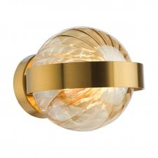 a gold wll light fitting with segmented amber glass globe shade
