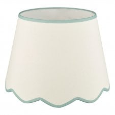 A large, neutral scallop shade lamp shade with blue edge detail