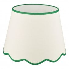 A large, neutral scallop shade lamp shade with green edge detail 