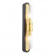 A matt black and gold slim wall light with ribbed glass shade in an art deco inspired design