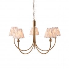 brass curved five light pendant with neutral ikat shades