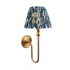 brass wall light with blue ikat pattern shade