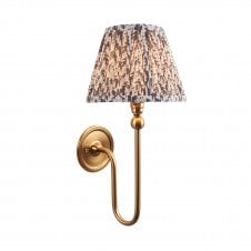 brass wall light with grey leaf pattern shade