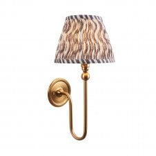 brass wall light with grey ripple pattern shade