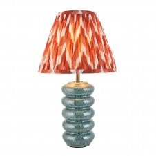 blue ceramic table lamp with orange zigzag pattern shade