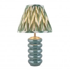 blue ceramic table lamp with green zigzag pattern shade
