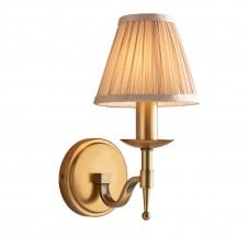 traditional antique brass wall light with beige shade