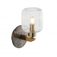 modern wall light in a brass finish with brown emperador marble backplate and ribbed glass shade