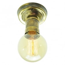 Vintage brass light bulb holder shown with a vintage filament light bulb