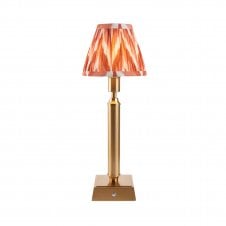 brass rechargeable table lamp with orange zigzag pattern shade