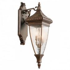 ornate exterior wall lantern in bronze with rain effect glass panels