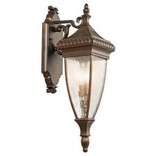 ornate exterior wall lantern in bronze with rain effect glass panels
