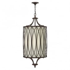 rustic ceiling pendant in bronze with patterned frame and fabric inner shade