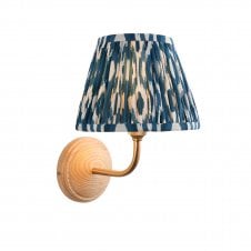 wood & brass wall light with blue ikat pattern shade