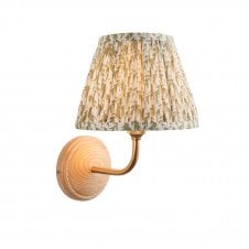 wood & brass wall light with green leaf pattern shade