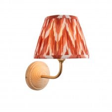 wood & brass wall light with orange zigzag pattern shade