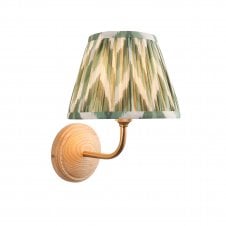 wood & brass wall light with green zigzag pattern shade
